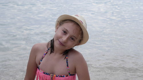 Portrait of girl standing at beach