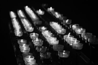 High angle view of illuminated candles on table