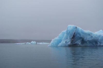 Scenic view of frozen sea against sky