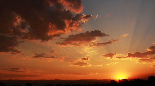 Scenic view of dramatic sky during sunset