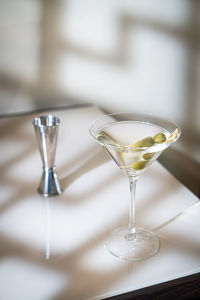 Close-up of wineglasses on table