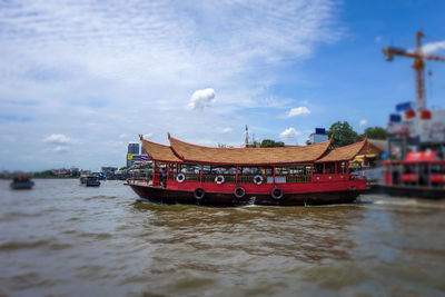 View of boat in river against sky
