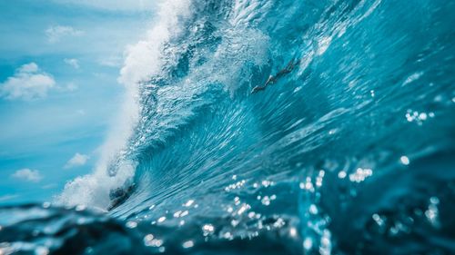 Close-up of frozen sea waves breaking