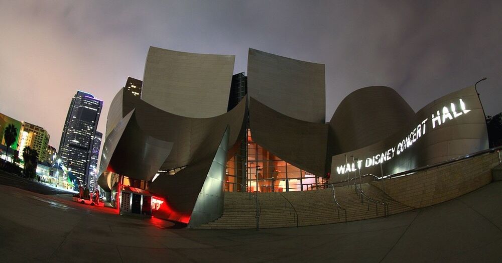 architecture, built structure, building exterior, sky, low angle view, illuminated, no people, building, cloud - sky, sunlight, outdoors, architectural feature, railing, roof, city, dusk, in a row, sunset, arts culture and entertainment, travel destinations