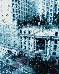Full frame shot of wet glass window in rainy season