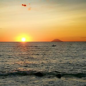 Scenic view of sea against orange sky