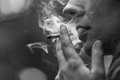 Close-up of man smoking cigarette