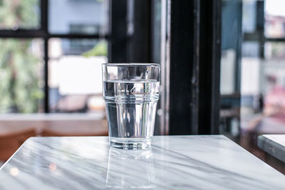 Close-up of water in glass on table