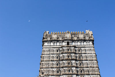 Low angle view of building against clear blue sky