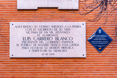 Information sign on brick wall