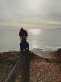 Full length of man on beach against sky