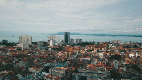 High angle view of buildings against sky in city