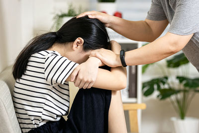 Rear view of young woman looking away