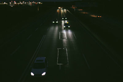 High angle view of vehicles on road at night