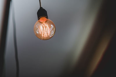 Low angle view of illuminated light bulb