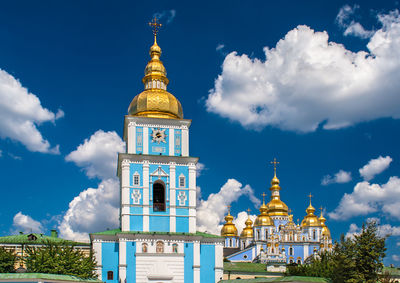 Low angle view of a building against cloudy sky