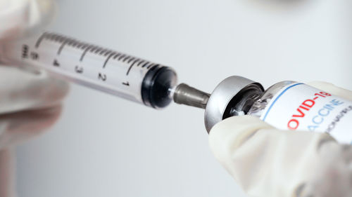 Close-up of human hand holding eyeglasses