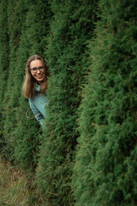 Portrait of smiling young woman on land