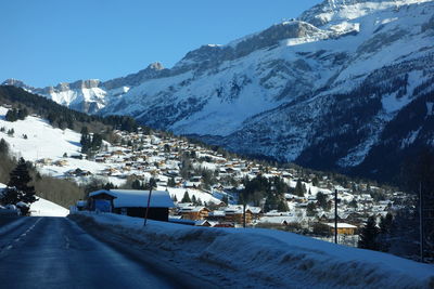 Scenic view of snow covered mountains against sky