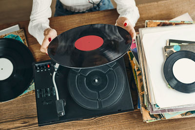 Listening to music from vinyl record. playing music. retro music party. vintage style. analog media