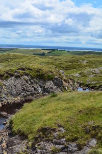 Scenic view of land against sky