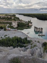 High angle view of river against cloudy sky