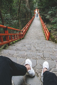 Low section of people walking on road