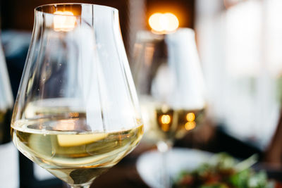 Close-up of wine glass on table in restaurant