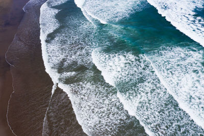 Aerial view of sea waves at beach