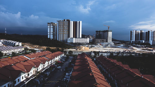 High angle view of buildings in city against sky