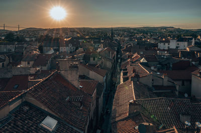 Aerial view of townscape against sky at sunset