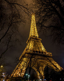 Low angle view of illuminated building against sky at night