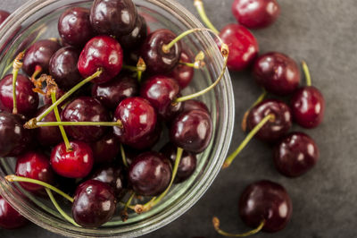 Directly above shot of cherries in glass bowl on table