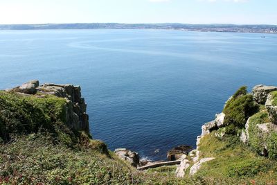 High angle view of sea and mountains against sky