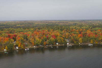 Scenic view of trees during autumn against sky