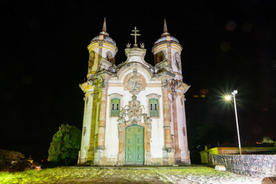 Low angle view of illuminated building at night