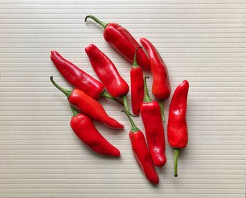 Close-up of red chili peppers on table