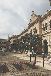 View of old building against cloudy sky