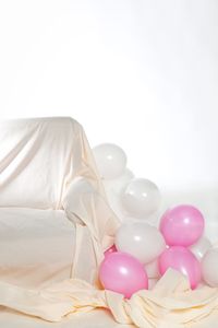 High angle view of balloons against white background