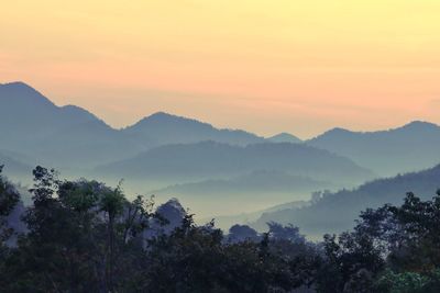 Scenic view of mountains against sky during sunset