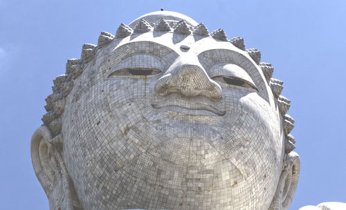 Low angle view of statue of building against sky