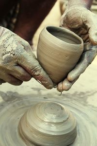 Close-up of man pottery