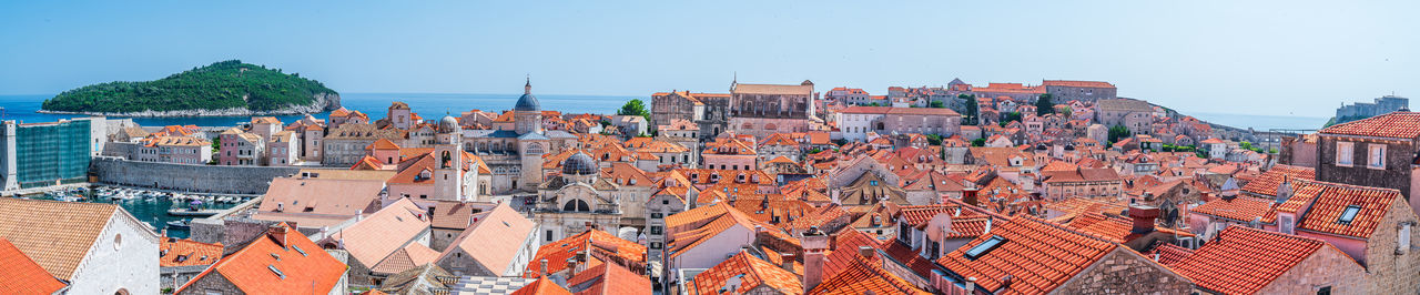 High angle view of buildings in city against clear sky