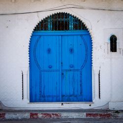 Closed blue door of building