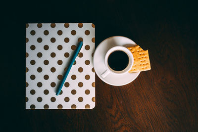 High angle view of coffee cup on table