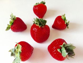 Close-up of strawberry over white background