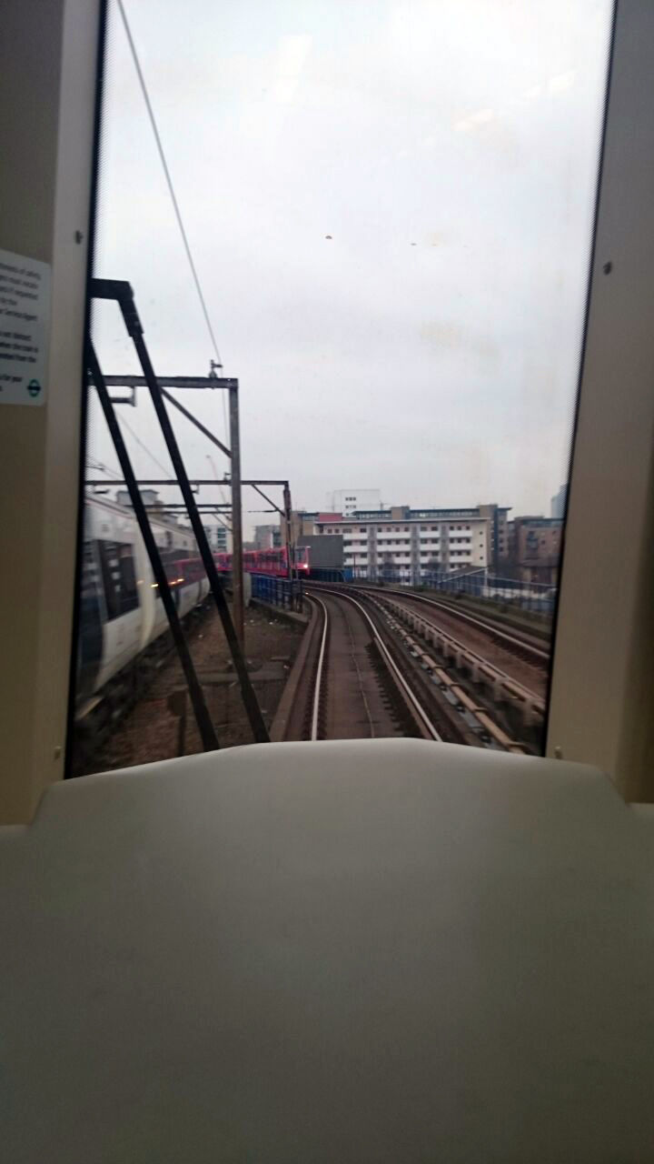 RAILROAD TRACKS IN CITY AGAINST SKY