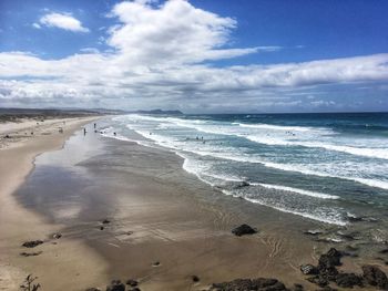 Scenic view of beach against sky