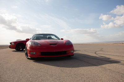 Vintage car on land against sky