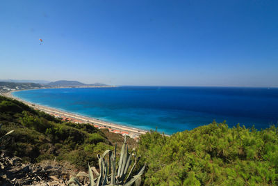 High angle view of sea against clear blue sky